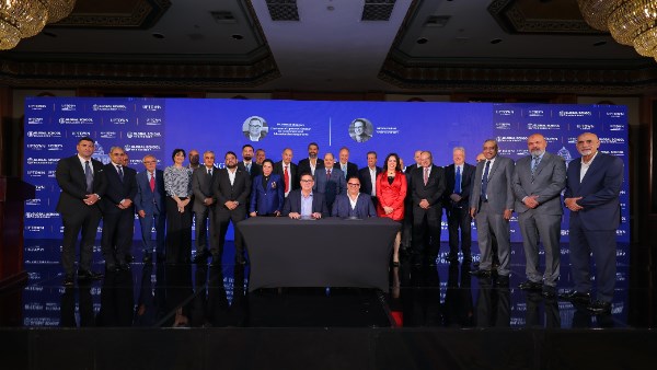 Photo of the Uptown 6 October team along with Ron Packard and key leadership from Global School Management